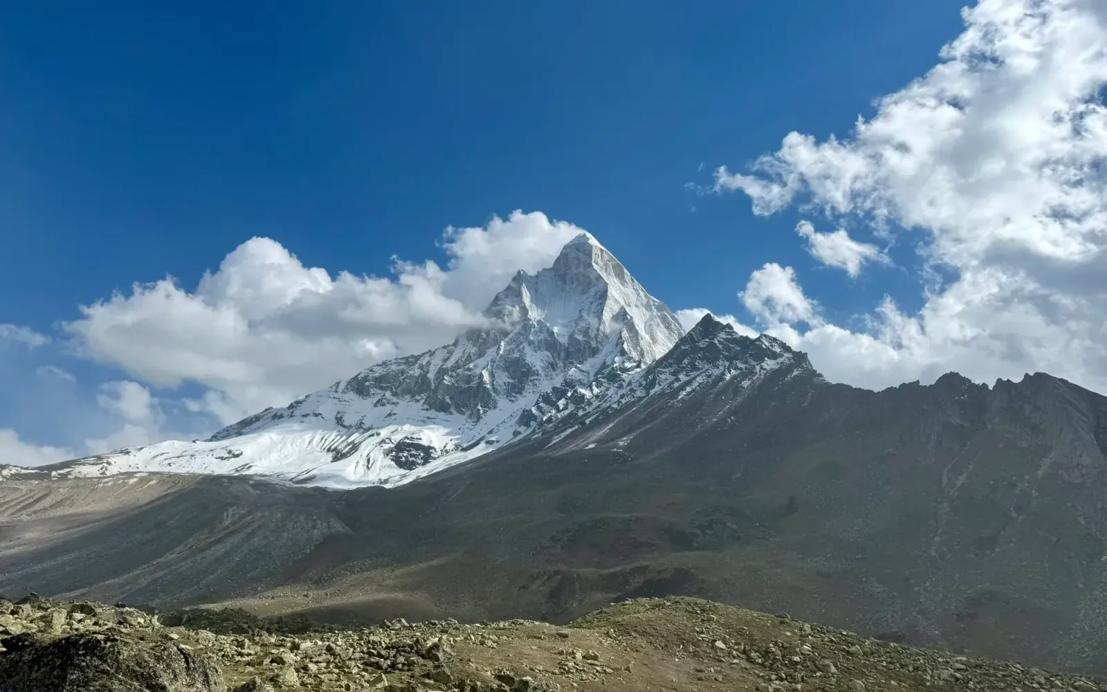 The snow-covered pyramid of Mount Shivling above a rocky valley in the Garhwal Himalaya